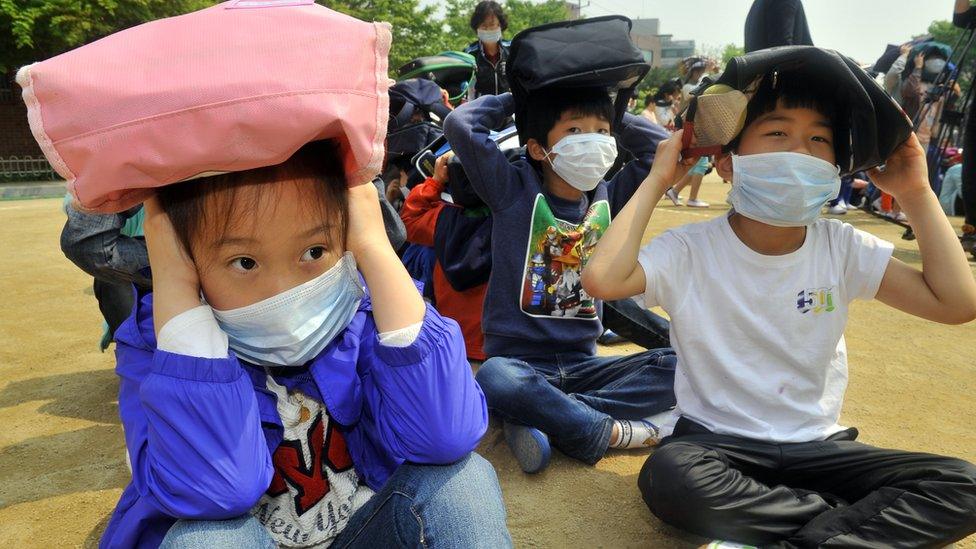 South Korean children taking part in an earthquake preparedness drill