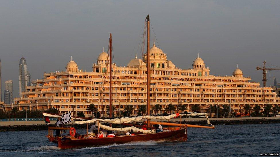 Dhow sailing past Dubai waterfront