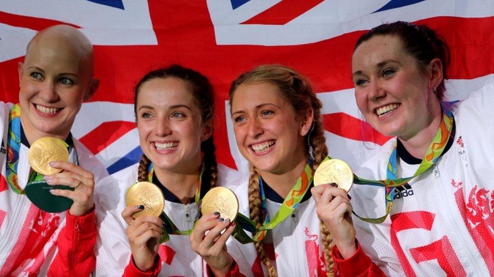 Great Britain's team pursuit quartet celebrate with their gold medals