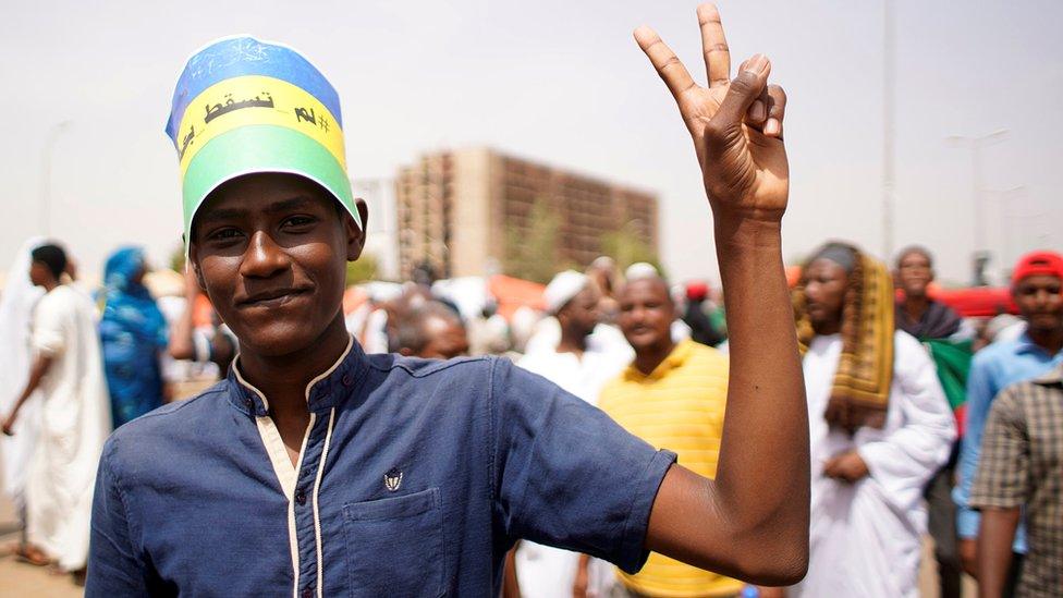 Protester shows the victory symbol