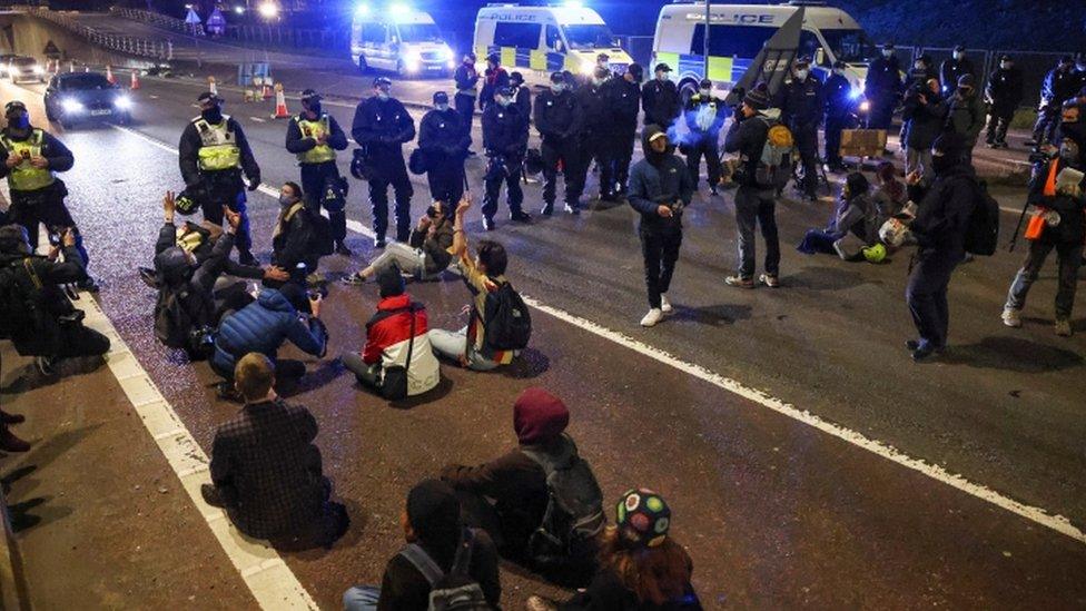 Police and protesters on the M32