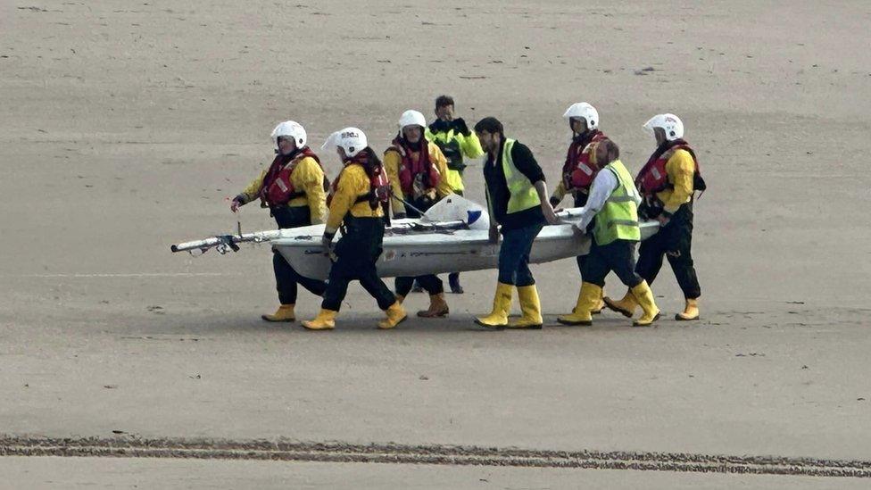 Volunteers carrying in HMS Betty