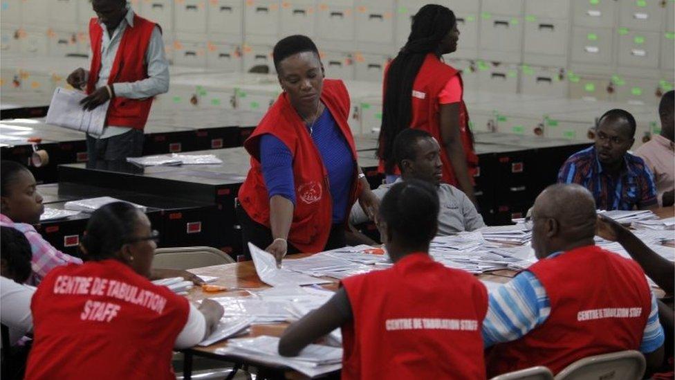 Electoral workers count ballots at a tabulation center in Port-au-Prince, Haiti, Monday, Nov. 21, 2016