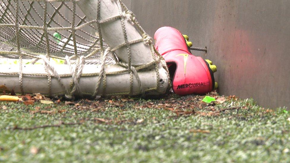 football boot behind goals