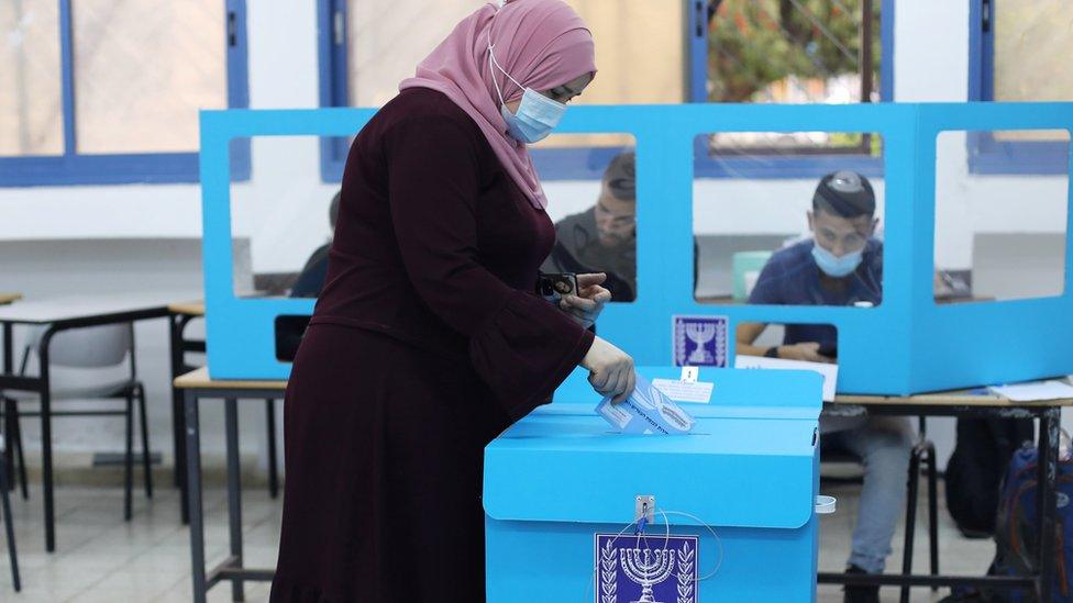 An Arab woman votes in Israel's general election in Kafr Manda (23 March 2021)