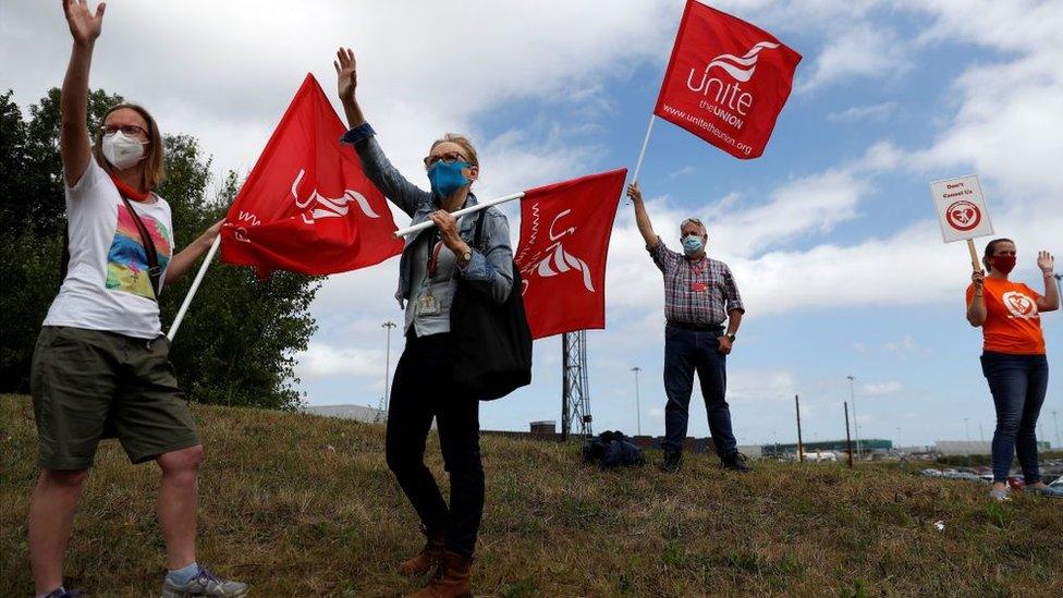 Easyjet employees demonstrate outside Stansted Airport, on August 20, 2020 following the decision by the airline to close its operations at Stansted