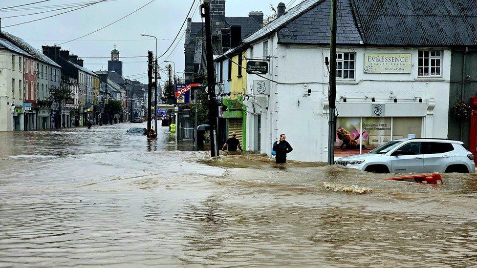 Floodwater through a street in Midleton, County Cork