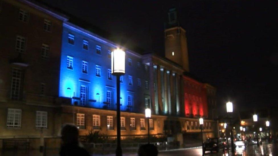 Norwich City Hall lit up in blue, white and red