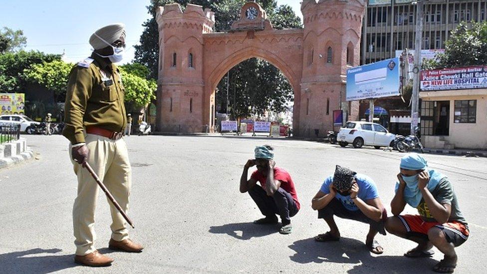 police enforcing curfew in Punjab