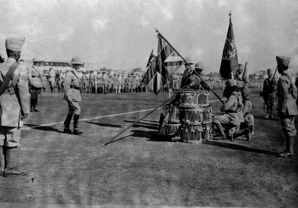 The Duke of Connaught (1850 - 1942) presenting colours at Poona to the 110th Madras.