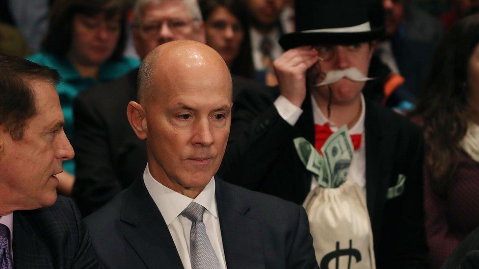 Former Equifax CEO Richard Smith photobombed by Monopoly Man