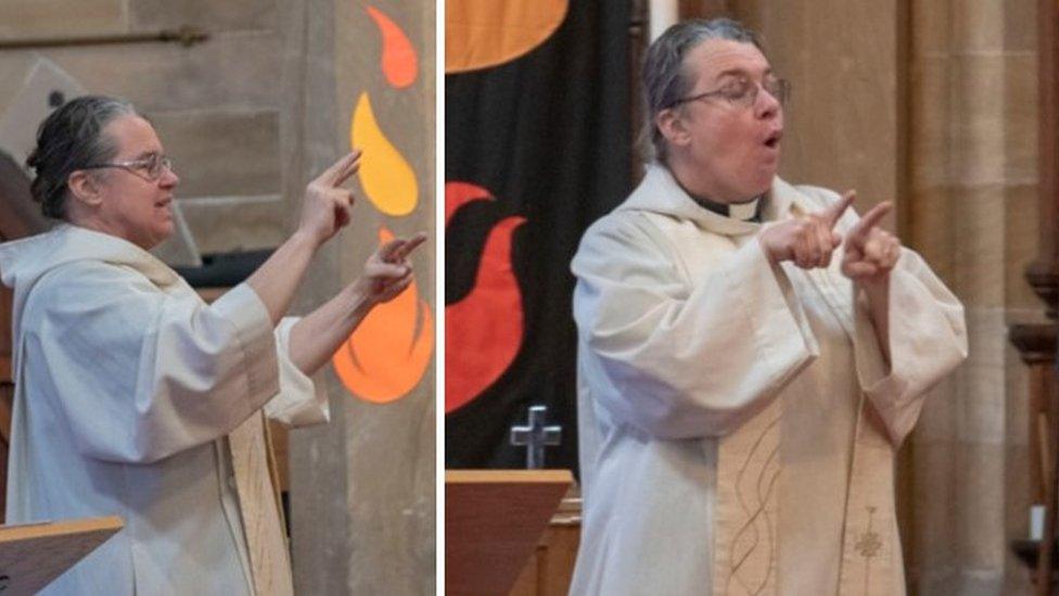 Rev Dr Hannah Lewis signing a sermon in British Sign Language