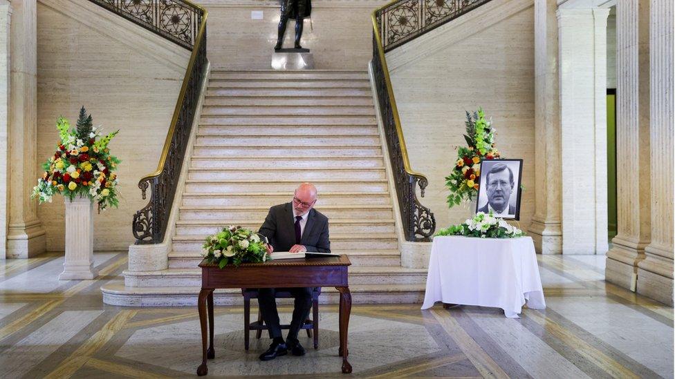 Assembly Speaker Alex Maskey signs Book of Condolence at the Great Hall, Stormont