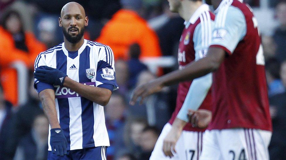 West Bromwich Albion"s French striker Nicolas Anelka gestures as he celebrates scoring their second goal during the English Premier League football match between West Ham United and West Bromwich Albion at The Boleyn Ground, Upton Park in east London on December 28, 2013.