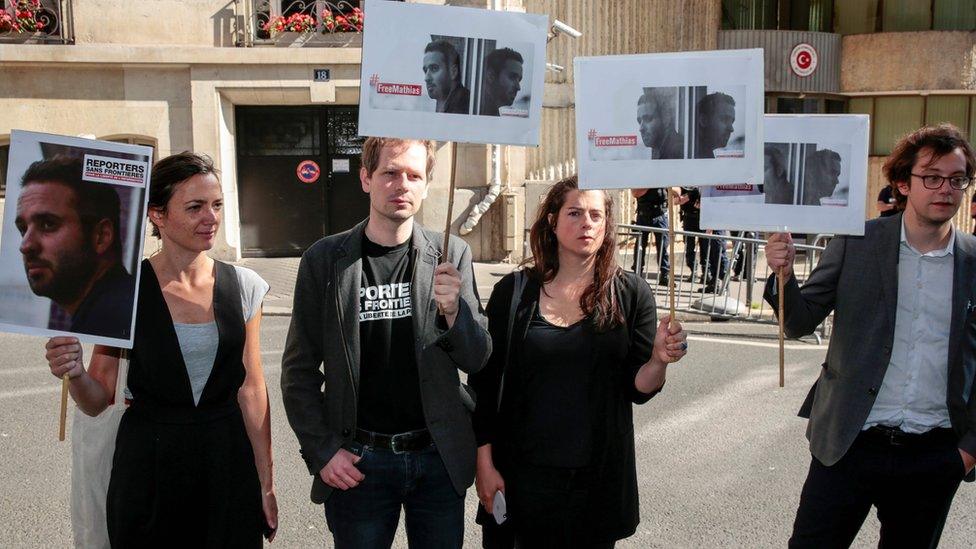 People take part in a protest calling for the release of Depardon