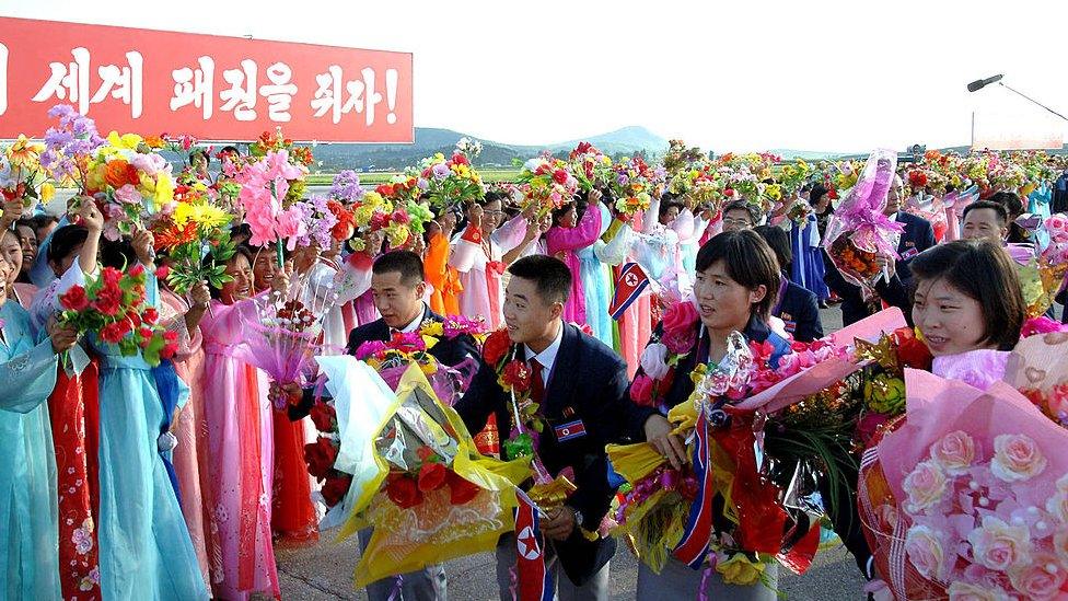 North Korea's 2012 Olympics squad returned home to a heroes' welcome, with cheering crowds lining the streets and the cabinet hosting a celebration banquet, according to the official news agency