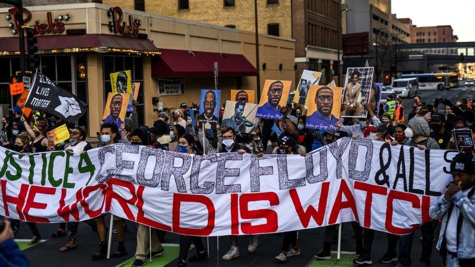 People gather during a demonstration outside the Hennepin County Government Center on March 29, 2021 in Minneapolis