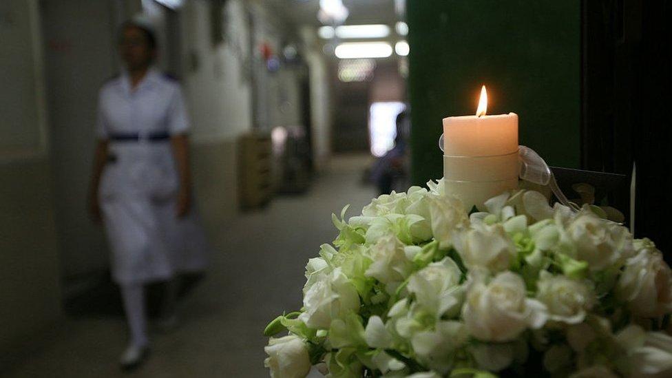 A candle being lit at Cama Hospital, one of the sites of last year's terror attacks in Mumbai on November 26, 2009.