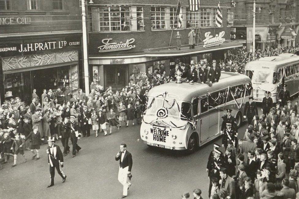 1955 FA cup parade bus passes by crowds in front of Fenwick's