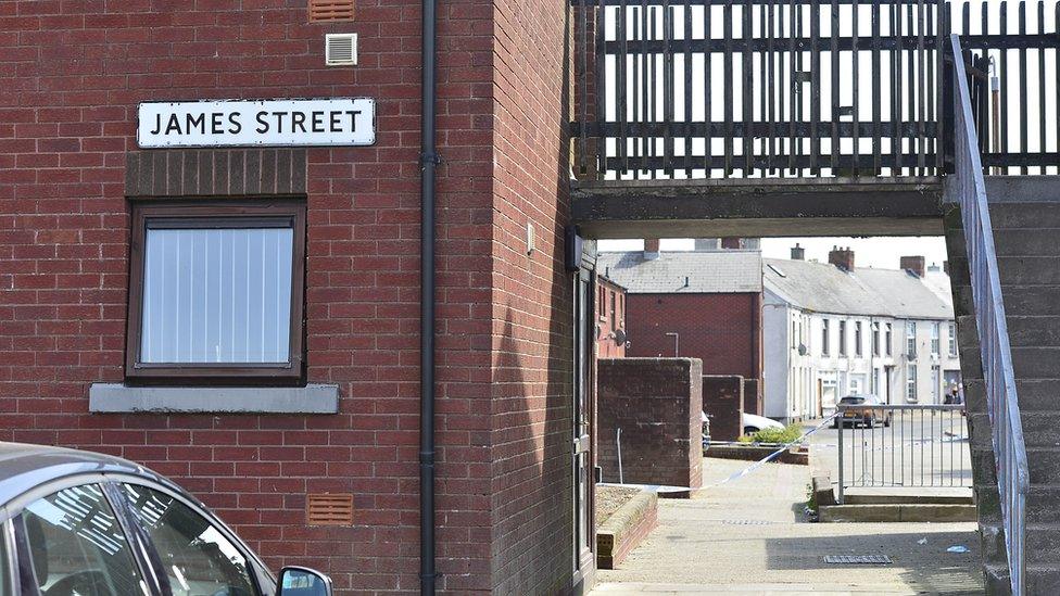 A police cordon has been erected near homes on James Street