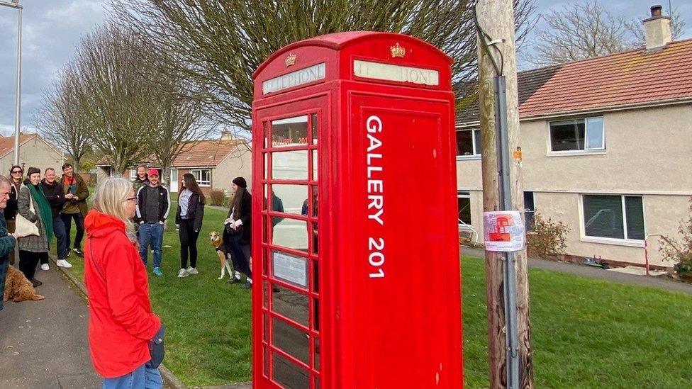 Artist Lada Wilson at the 201 Telephone Box Gallery near St Andrews