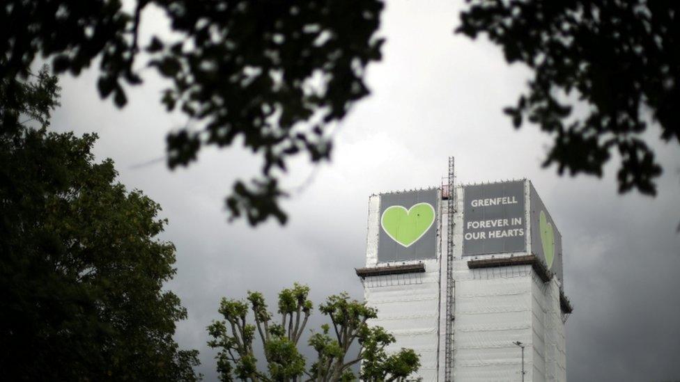 Grenfell tower is seen shrouded by scaffolding and covers two years after the fire