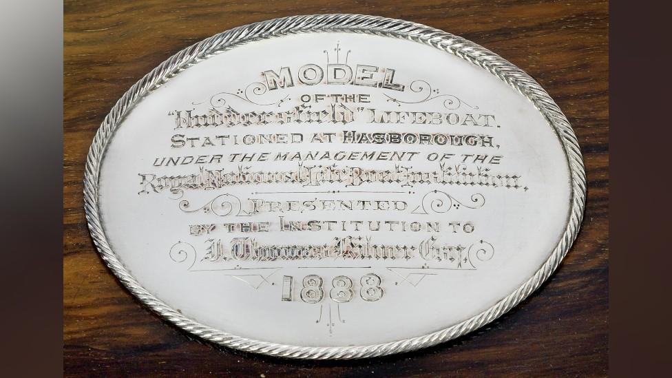 Silver plate inscribed with details on who the model was presented to