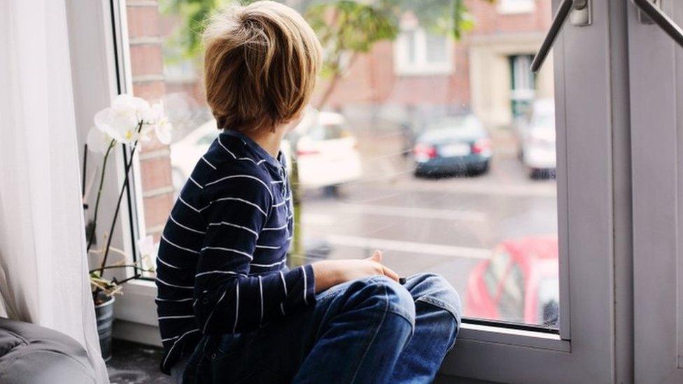 Boy sitting alone