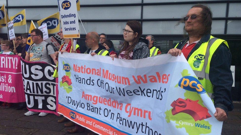 Museum staff gathered outside the Swansea's National Waterfront Museum on Saturday