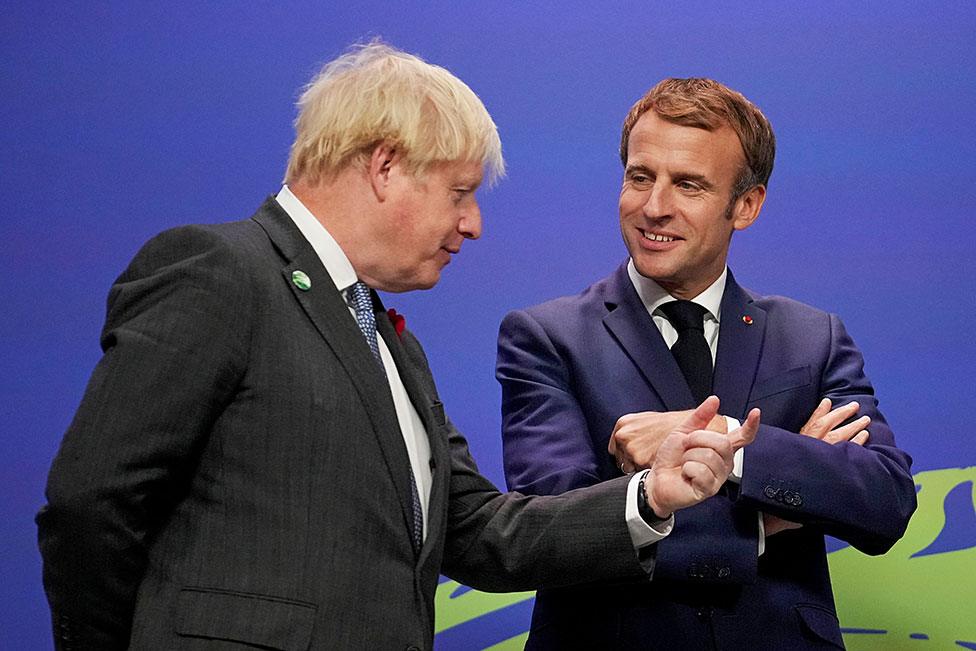 Prime Minister Boris Johnson greets France's President Emmanuel Macron during arrivals at the UN Climate Change Conference (COP26) in Glasgow, Scotland, on 1 November 2021