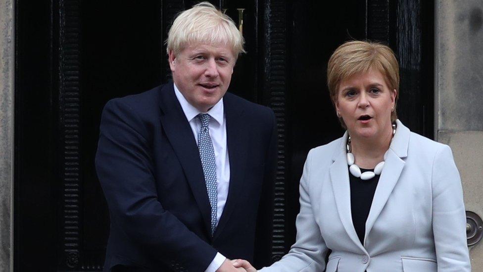 Scotland's First Minister Nicola Sturgeon welcomes Prime Minister Boris Johnson outside Bute House in Edinburgh ahead of their meeting.