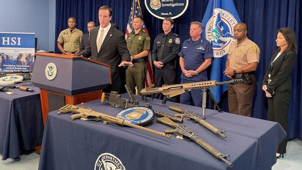 Anthony Salisbury, Special Agent in Charge of Homeland Security Investigations Miami speaks as weapons seized by U.S. authorities that had been destined for illegal export to Haiti are displayed at a news conference in Miami, Florida, U.S. August 17, 202