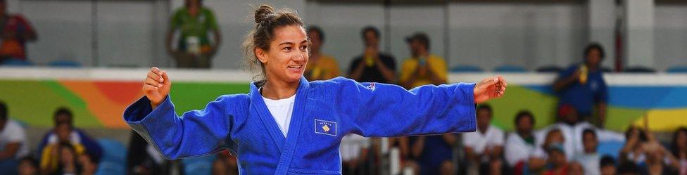 Majlinda Kelmendi of Kosovo celebrates winning the gold medal against Odette Giuffrida of Italy during the WomenÂ's -52kg gold medal final on Day 2 of the Rio 2016 Olympic Games