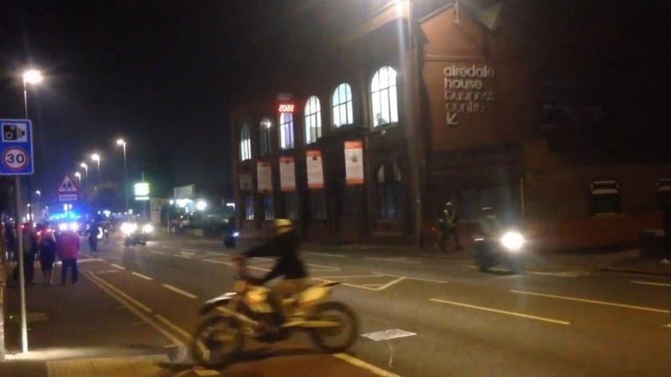 A biker rides on the pavement