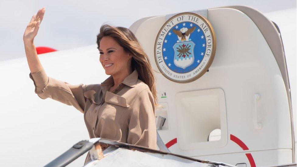 Melania Trump waves as she lands in Malawi