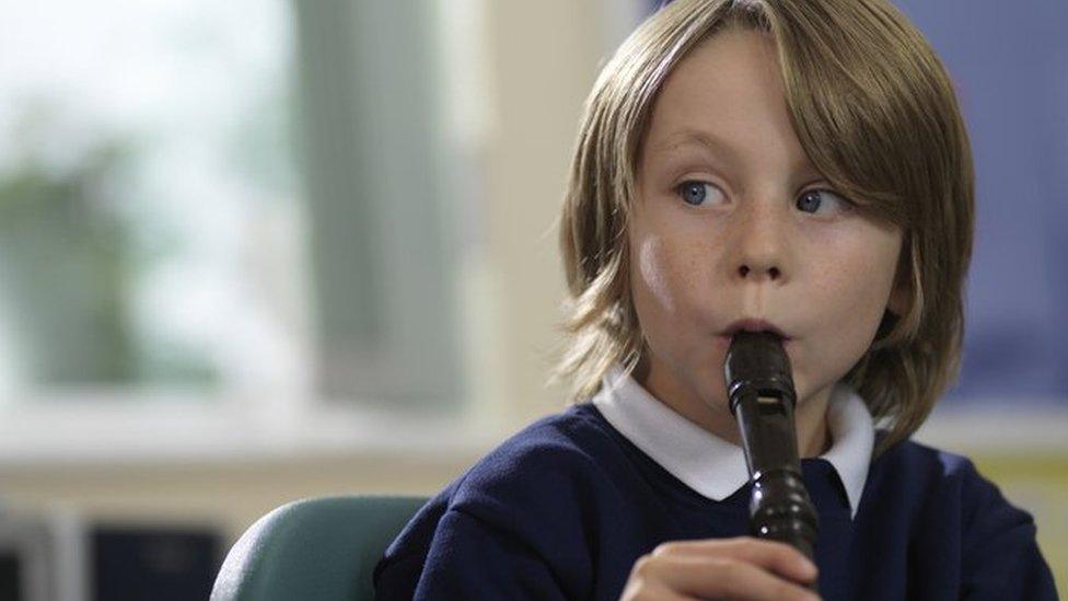 Child playing recorder