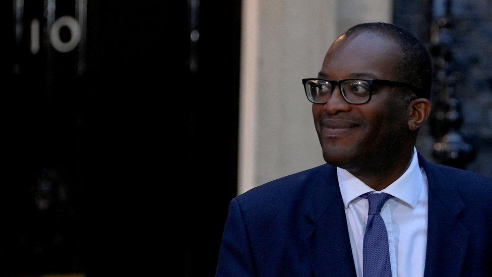 New British Chancellor of the Exchequer Kwasi Kwarteng walks outside Number 10 Downing Street in London