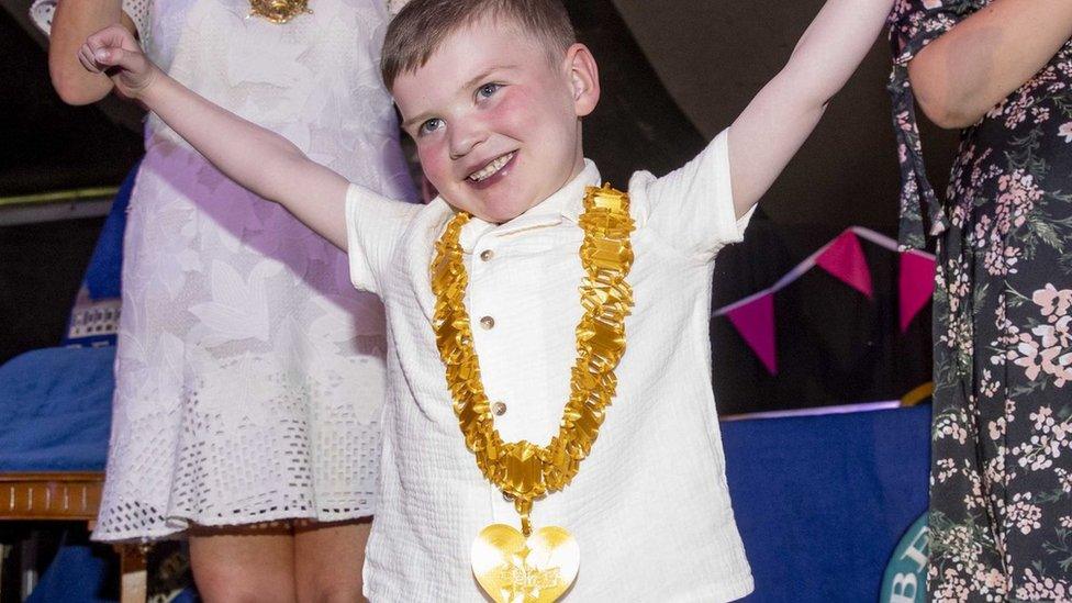 Dáithí Mac Gabhann celebrates with a key to the city around his neck