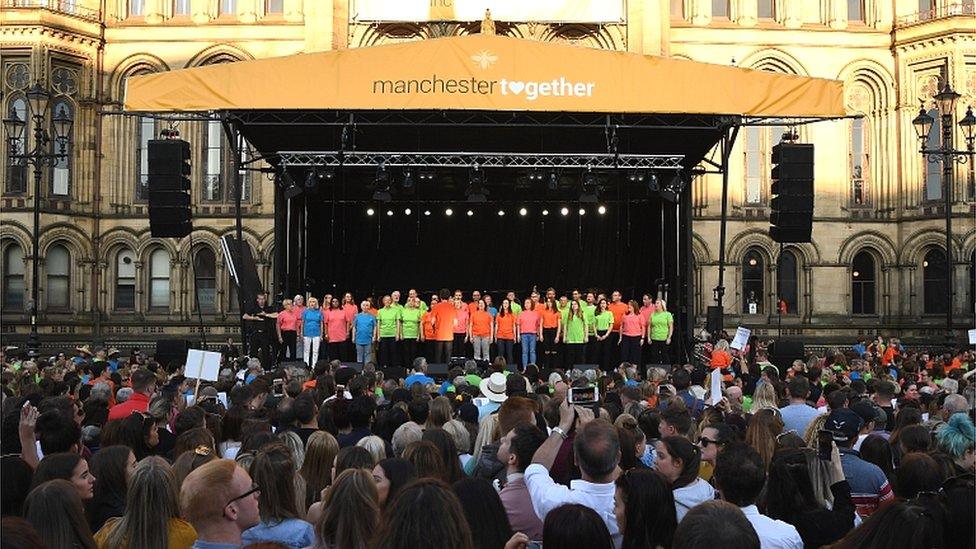 A choir on stage at Manchester Together