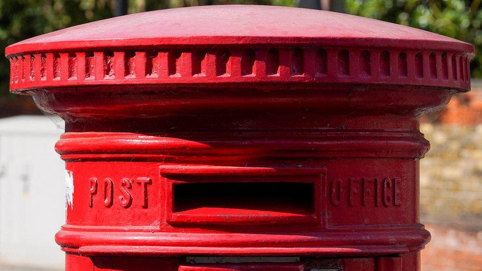 A Royal Mail post box is pictured