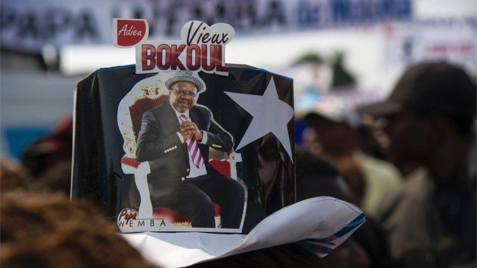 A person wears a hat with a picture of Papa Wemba reading "Goodbye Vieux Bokoul" in Kinshasa, DR Congo - Tuesday 2 May 2016