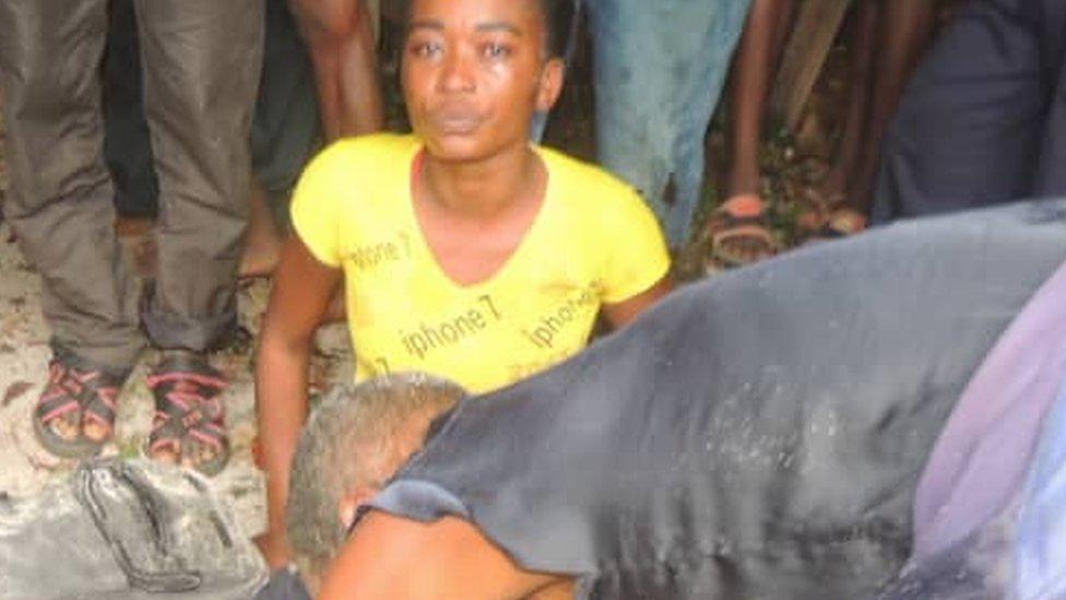 Shocked woman at the shore of Lake Mai-Ndombe in DR Congo