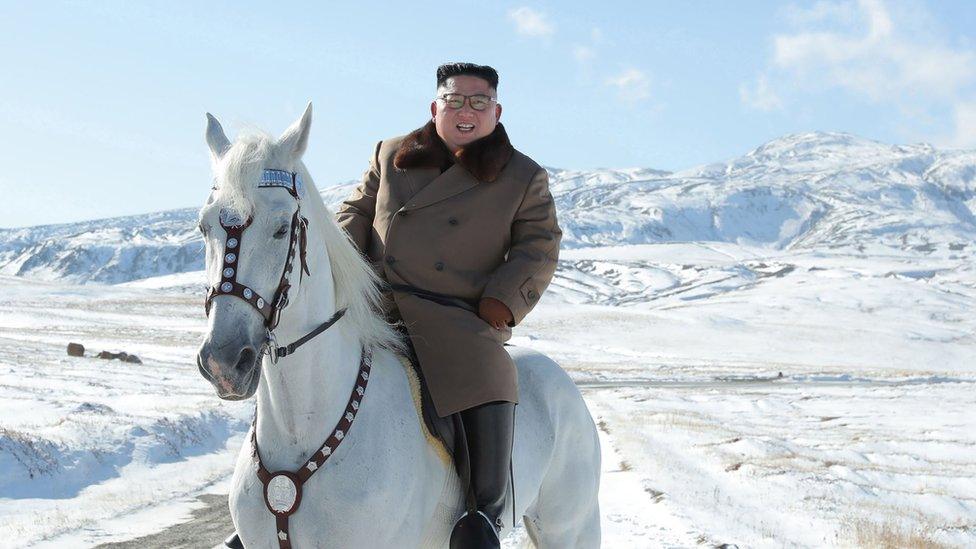 North Korean leader Kim Jong Un riding a white horse amongst the first snow at Mouth Paektu.