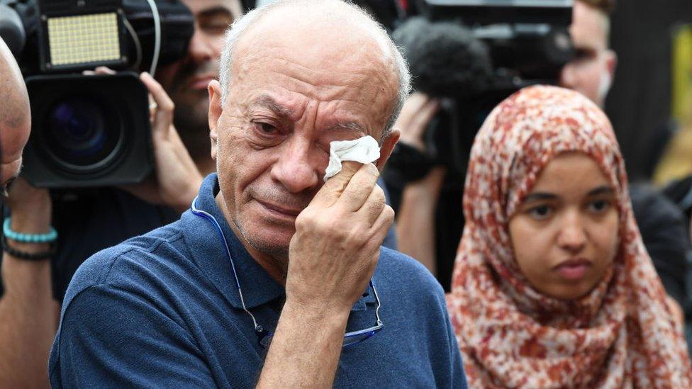 Saeed Maasarwe wipes away tears while talking to media at a public vigil for his daughter