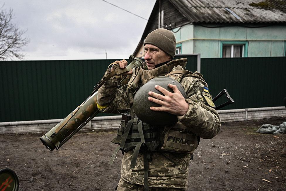 A Ukrainian soldier holds an anti-tank launcher north-east of Kyiv on 3 March 2022