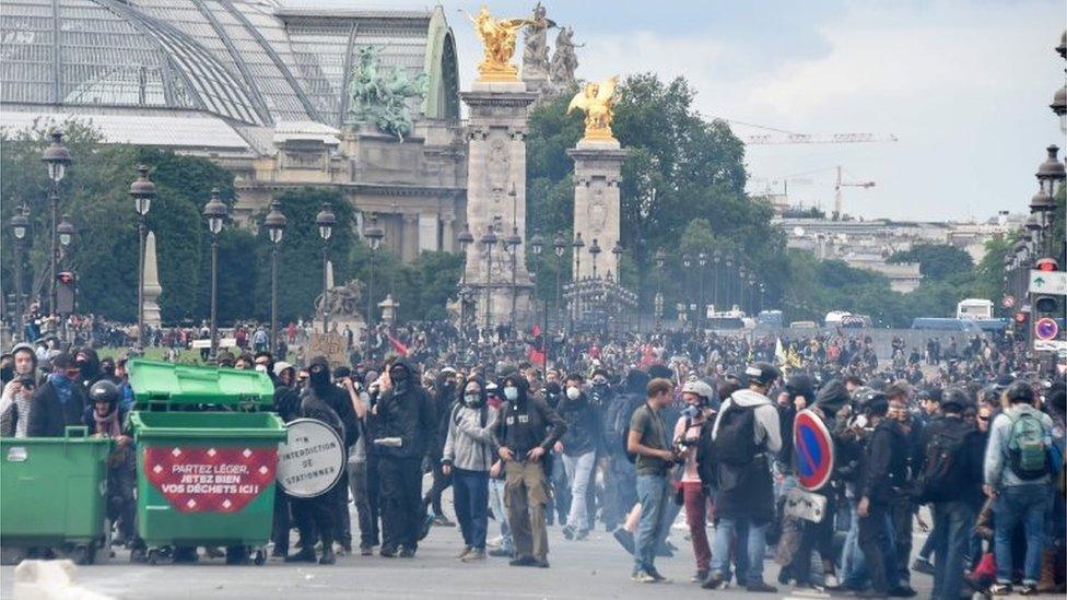 Protesters gather during a demonstration against proposed labour reforms near the Grand Palais, in Paris on June 14, 2016