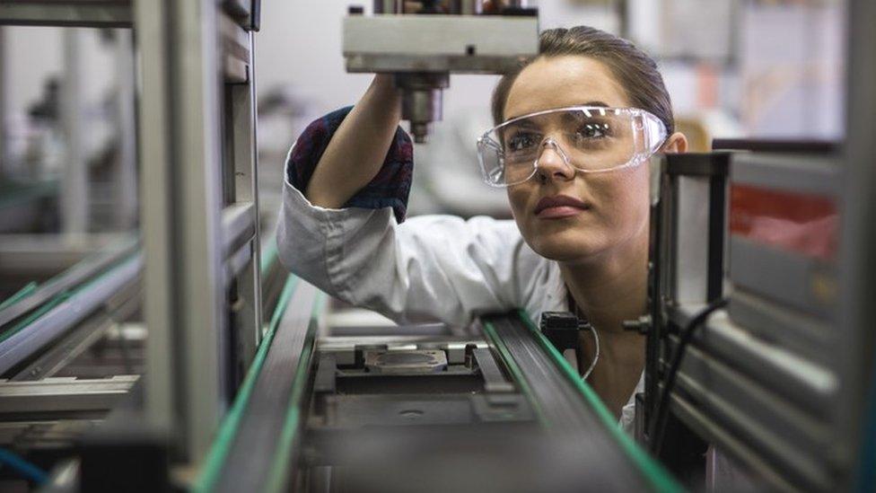 Female engineer working on production line