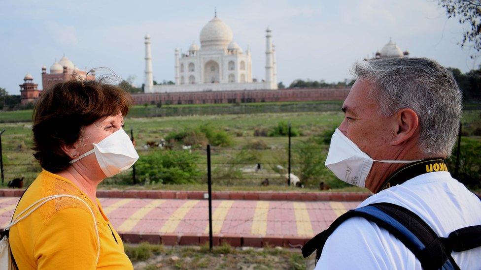 A couple in front of the Taj Mahal