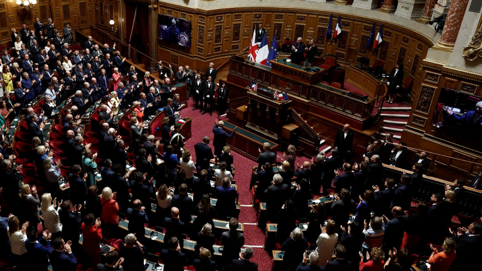 King Charles is applauded by members of parliament after he delivered his speech at the French Senate in Paris