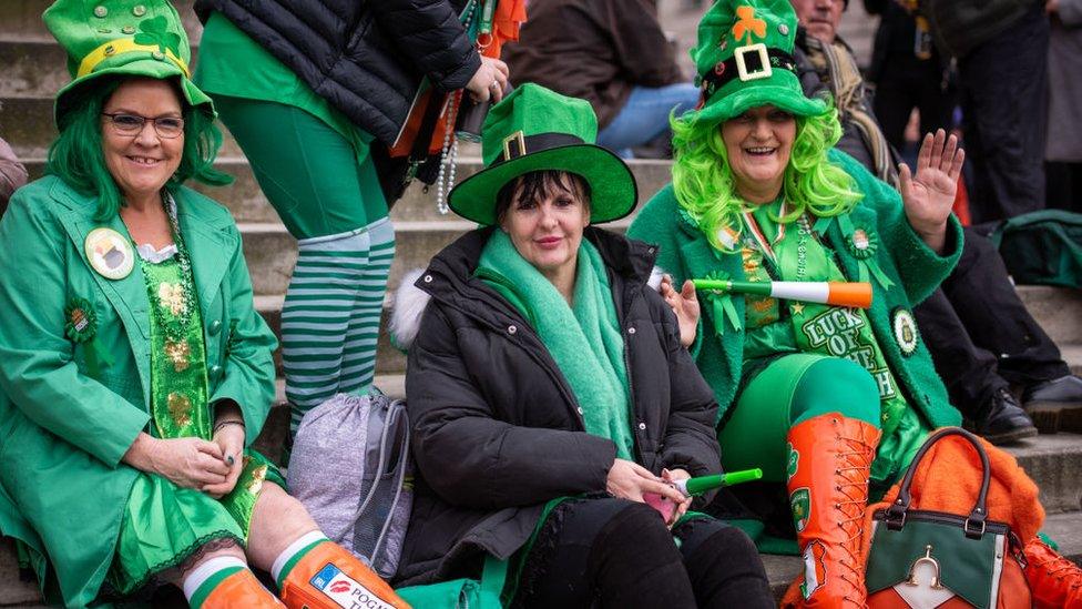 Parade watchers decked in green wave at last year's parade